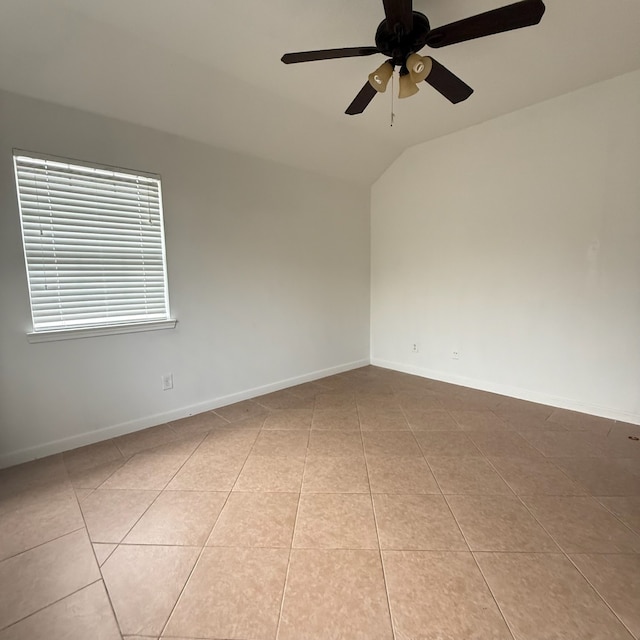 11422 Royal Thistle Ct, Houston, TX 77088 - empty room featuring ceiling fan, tile patterned floors, lofted ceiling, and baseboards