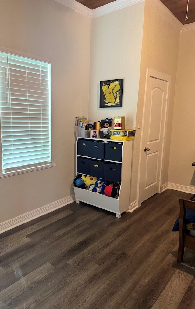 interior space with dark wood finished floors, baseboards, and ornamental molding