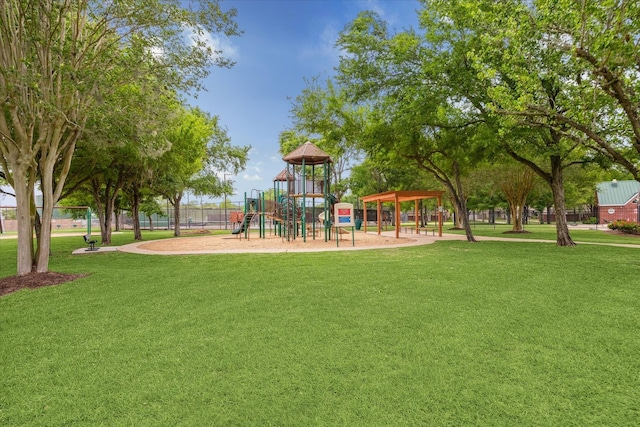 communal playground featuring a lawn