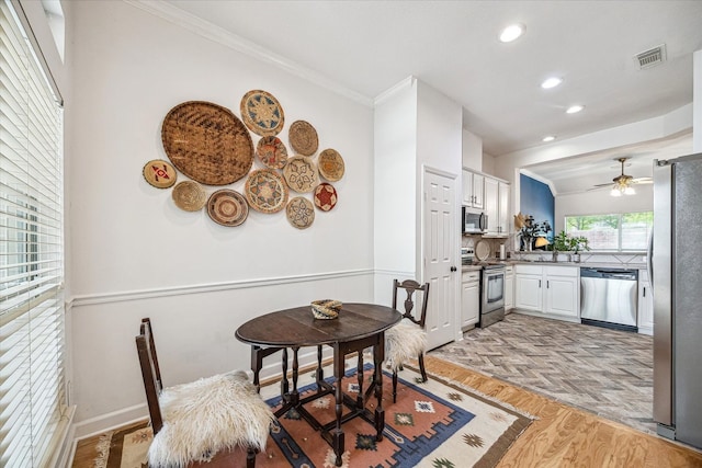 dining room featuring ornamental molding, visible vents, ceiling fan, and recessed lighting