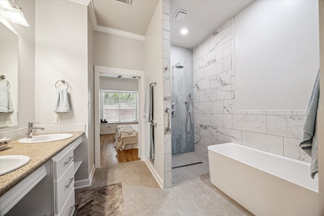 full bath with visible vents, a sink, a soaking tub, crown molding, and connected bathroom