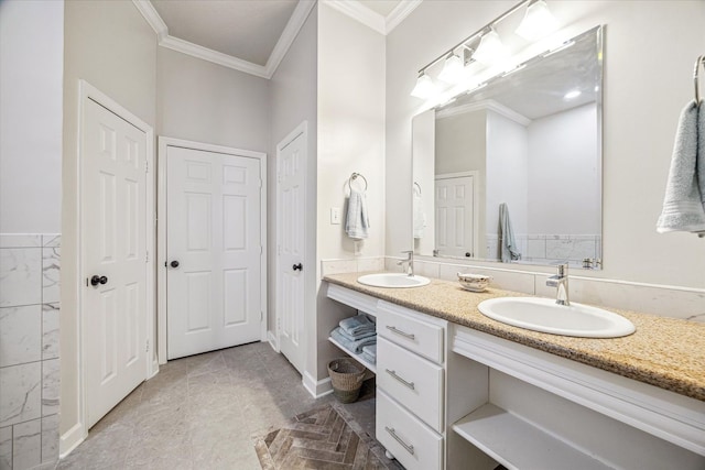 full bathroom with crown molding, double vanity, and a sink