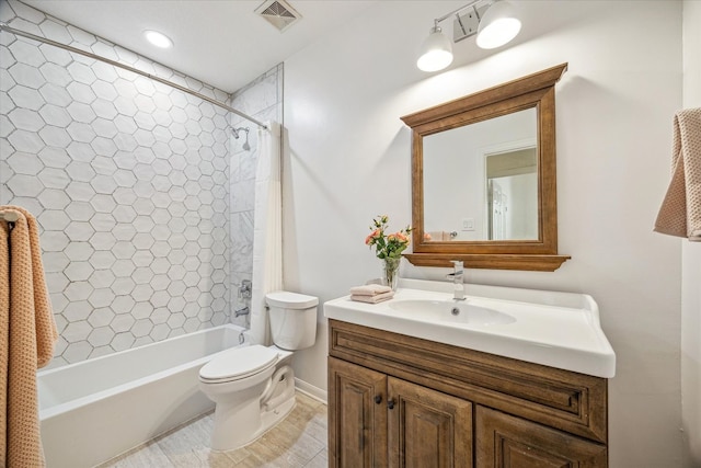 bathroom with visible vents, toilet, shower / bath combo with shower curtain, and vanity