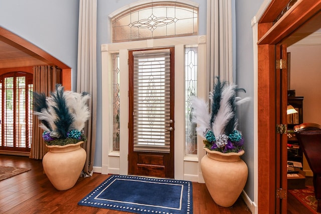 37703 Edgewater Dr, Pinehurst, TX 77362 - foyer entrance featuring wood finished floors and baseboards