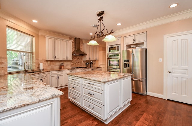 37703 Edgewater Dr, Pinehurst, TX 77362 - kitchen featuring appliances with stainless steel finishes, wall chimney range hood, decorative backsplash, light stone counters, and dark wood-style floors