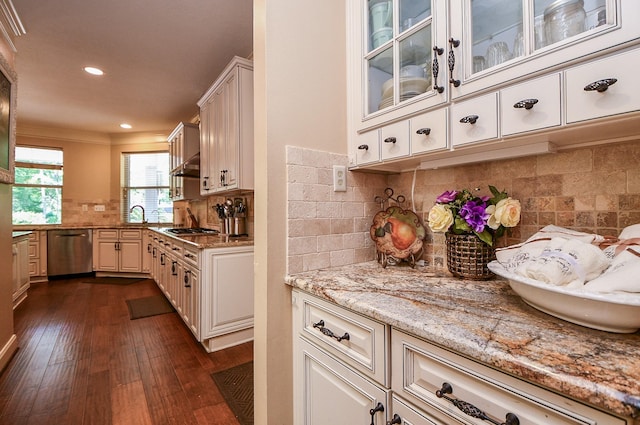 37703 Edgewater Dr, Pinehurst, TX 77362 - kitchen with stainless steel appliances, tasteful backsplash, dark wood-style flooring, recessed lighting, and light stone counters