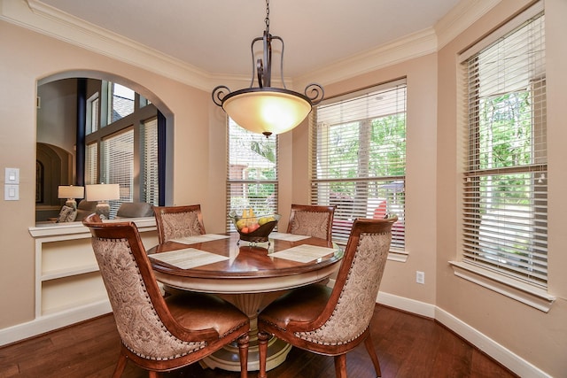 37703 Edgewater Dr, Pinehurst, TX 77362 - dining space featuring ornamental molding, plenty of natural light, and dark wood-style floors