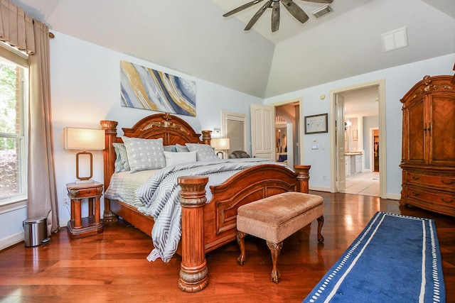 37703 Edgewater Dr, Pinehurst, TX 77362 - bedroom featuring wood finished floors, vaulted ceiling, ensuite bathroom, baseboards, and ceiling fan