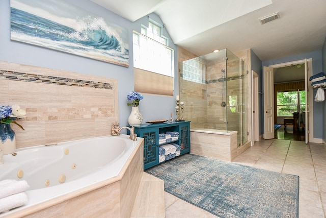 37703 Edgewater Dr, Pinehurst, TX 77362 - bathroom featuring tile patterned flooring, a shower stall, a tub with jets, and vaulted ceiling