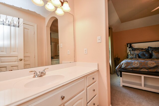 37703 Edgewater Dr, Pinehurst, TX 77362 - ensuite bathroom with vanity and a chandelier