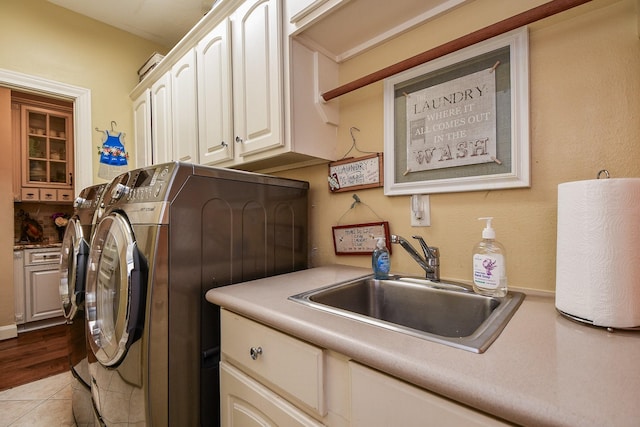 37703 Edgewater Dr, Pinehurst, TX 77362 - laundry area with cabinet space and washing machine and dryer