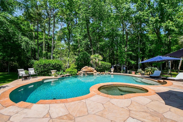 37703 Edgewater Dr, Pinehurst, TX 77362 - view of pool featuring a patio area and a pool with connected hot tub