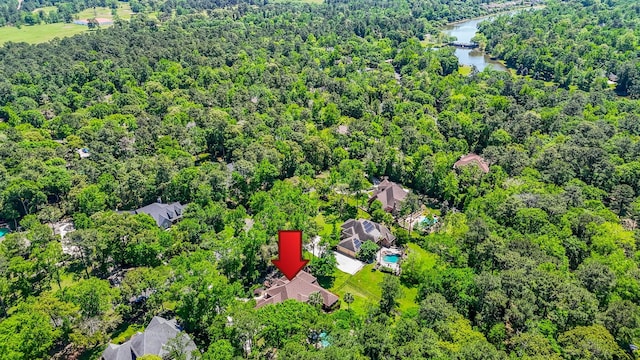 37703 Edgewater Dr, Pinehurst, TX 77362 - aerial view of a nearby body of water and a heavily wooded area
