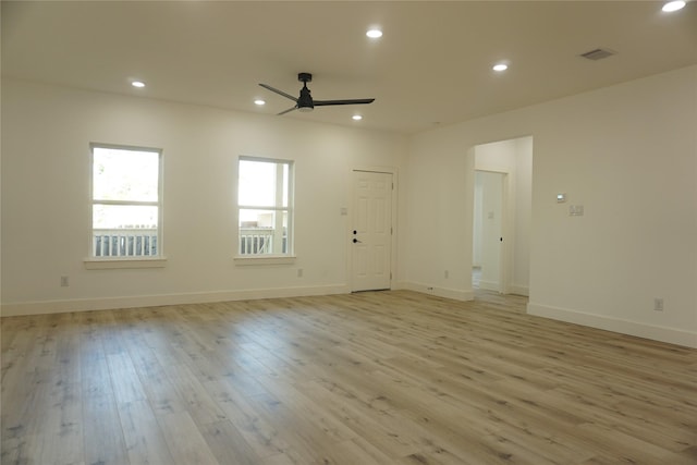 unfurnished room featuring light wood-style floors, ceiling fan, visible vents, and recessed lighting