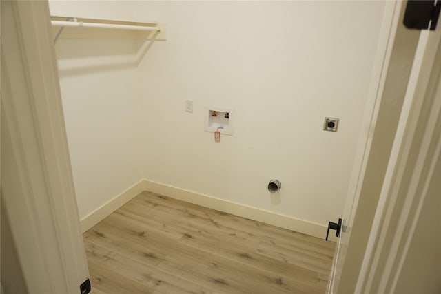 laundry room with baseboards, light wood-style floors, laundry area, electric dryer hookup, and hookup for a washing machine