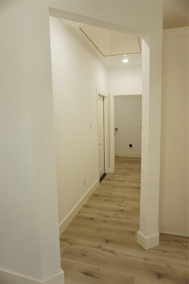 corridor with light wood-style flooring, recessed lighting, attic access, and baseboards