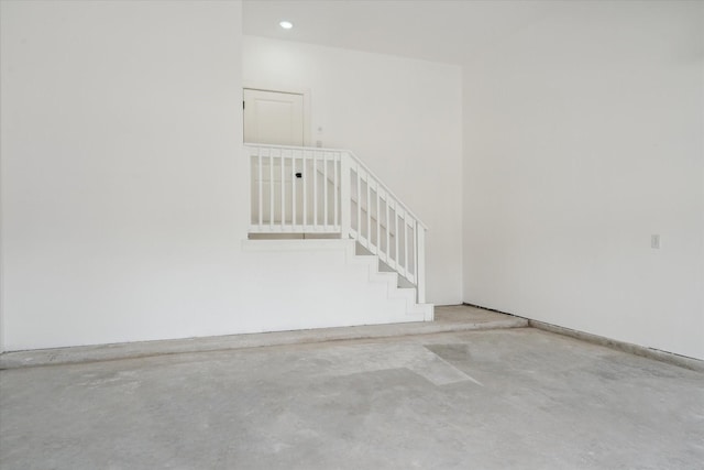 6319 Ivyknoll Dr, Houston, TX 77035 - stairs with unfinished concrete floors and recessed lighting