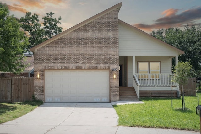 6319 Ivyknoll Dr, Houston, TX 77035 - view of front facade with brick siding, a porch, concrete driveway, and an attached garage