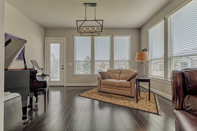 271 Spotted Saddle Ct, The Woodlands, TX 77382 - living area with an inviting chandelier, baseboards, and plenty of natural light