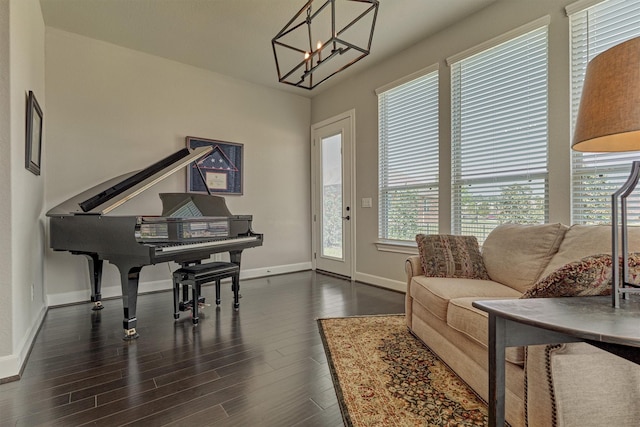 271 Spotted Saddle Ct, The Woodlands, TX 77382 - living area featuring dark wood-style flooring, baseboards, and an inviting chandelier