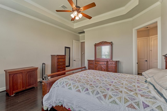 271 Spotted Saddle Ct, The Woodlands, TX 77382 - bedroom featuring dark wood-style floors, a raised ceiling, visible vents, a ceiling fan, and crown molding