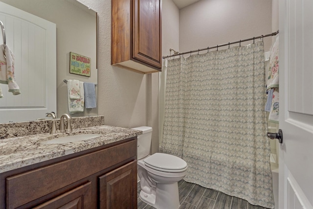 271 Spotted Saddle Ct, The Woodlands, TX 77382 - full bathroom with shower / bath combination with curtain, wood finished floors, vanity, and toilet