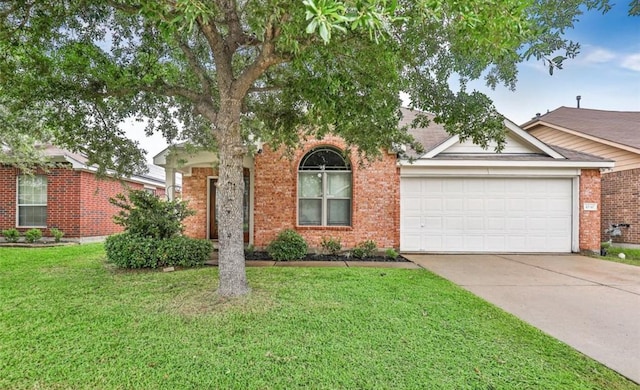 view of property hidden behind natural elements with a garage, a front yard, concrete driveway, and brick siding