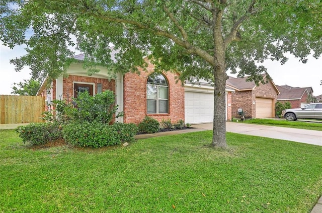 obstructed view of property featuring driveway, an attached garage, a front yard, brick siding, and fence