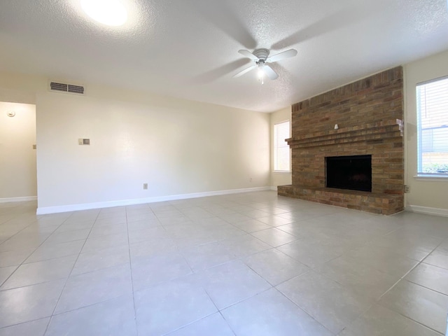 10555 Turtlewood Ct Unit 2102, Houston, TX 77072 - unfurnished living room with visible vents, ceiling fan, plenty of natural light, and a textured ceiling