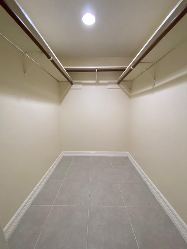 10555 Turtlewood Ct Unit 2102, Houston, TX 77072 - spacious closet featuring tile patterned flooring