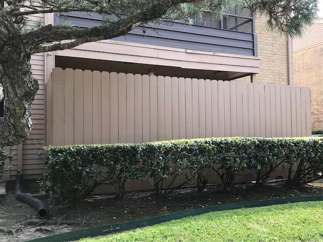 10555 Turtlewood Ct Unit 2102, Houston, TX 77072 - view of home's exterior featuring brick siding and fence
