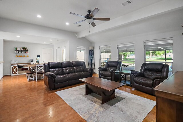 living area with lofted ceiling with beams, recessed lighting, a ceiling fan, visible vents, and wood finished floors