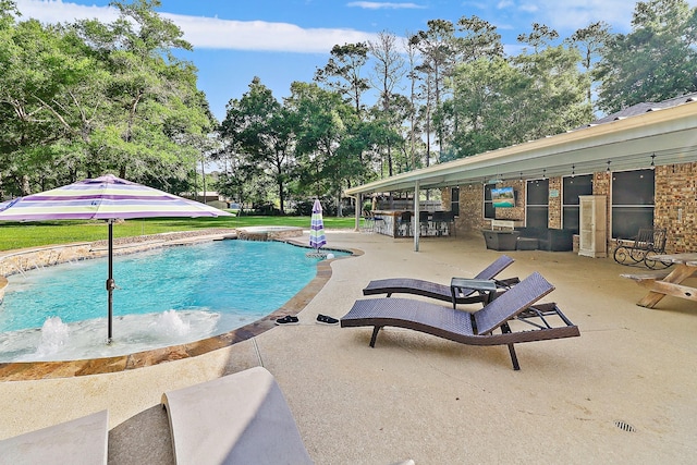 pool with a patio area and outdoor dry bar