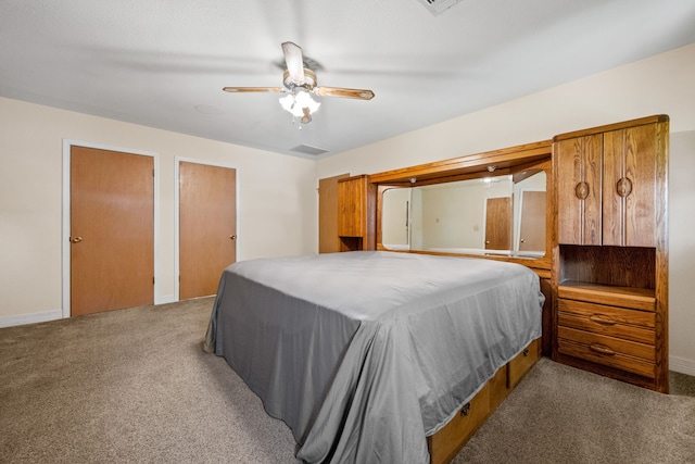 carpeted bedroom with baseboards and ceiling fan