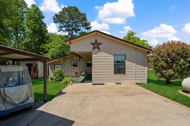 bungalow-style house with a front yard