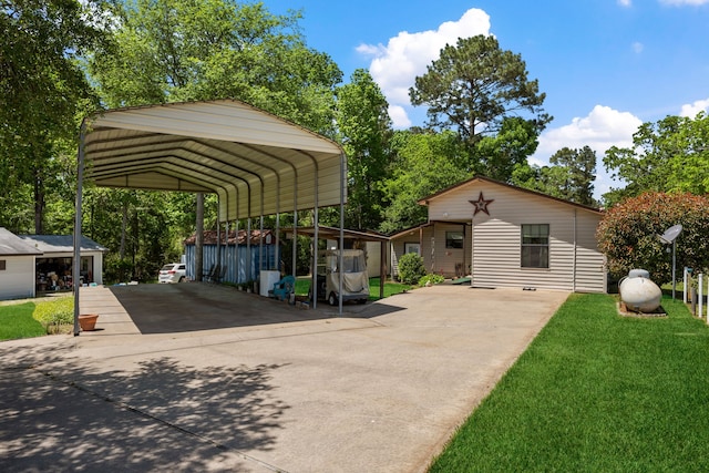 exterior space featuring a detached carport and driveway