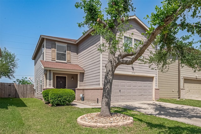 traditional-style home featuring fence, an attached garage, a front lawn, brick siding, and driveway