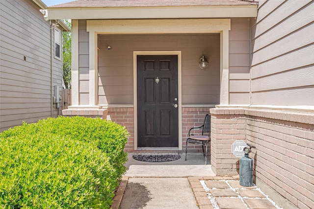entrance to property with brick siding