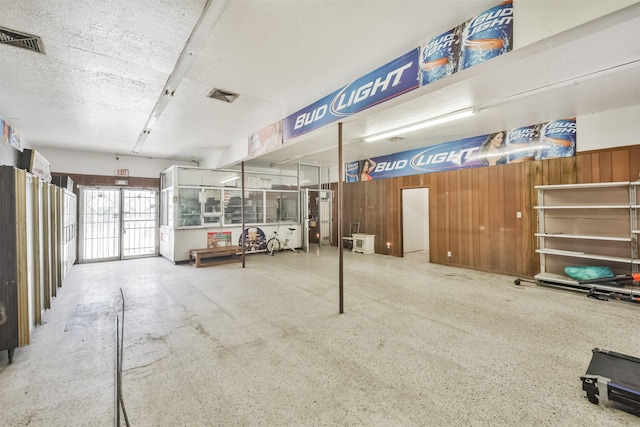 7846 Dayton St, Houston, TX 77012 - interior space with wood walls and visible vents