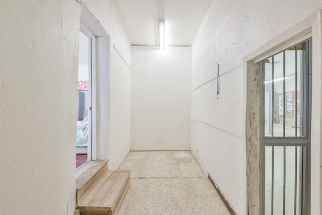 7846 Dayton St, Houston, TX 77012 - hallway with speckled floor and a textured wall