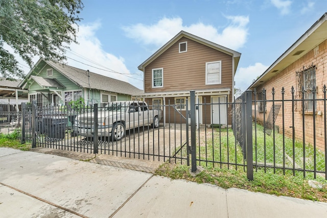 7846 Dayton St, Houston, TX 77012 - shotgun-style home featuring a gate and a fenced front yard