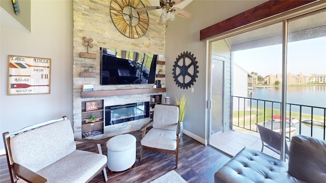 12500 Melville Dr Unit 211, Montgomery, TX 77356 - living area featuring a fireplace, wood finished floors, and a ceiling fan