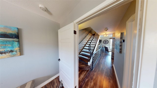12500 Melville Dr Unit 211, Montgomery, TX 77356 - stairway with wood finished floors and a textured ceiling
