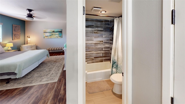 12500 Melville Dr Unit 211, Montgomery, TX 77356 - bedroom featuring wood finished floors and ensuite bathroom