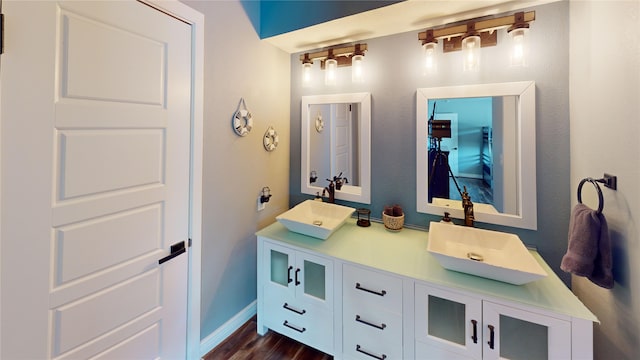 12500 Melville Dr Unit 211, Montgomery, TX 77356 - full bathroom with double vanity and wood finished floors