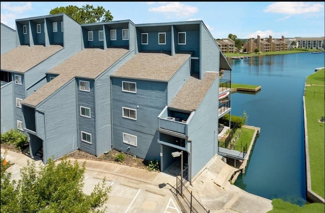 12500 Melville Dr Unit 211, Montgomery, TX 77356 - aerial perspective of suburban area with a nearby body of water