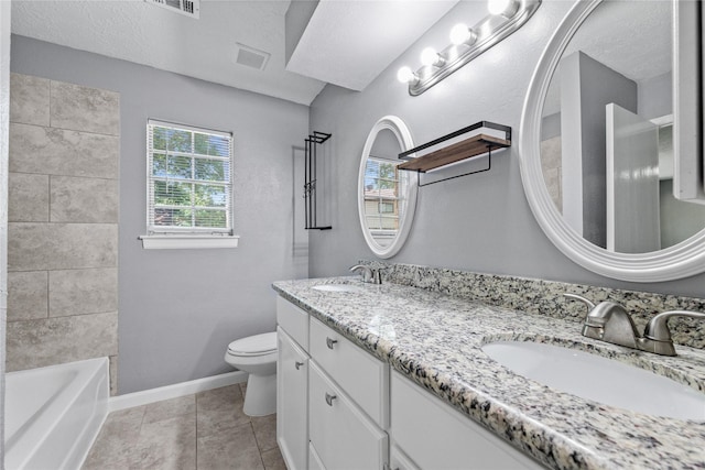 bathroom featuring a sink, visible vents, toilet, and baseboards