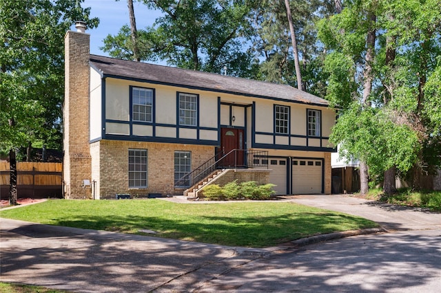 view of front facade featuring stucco siding, a chimney, driveway, brick siding, and fence