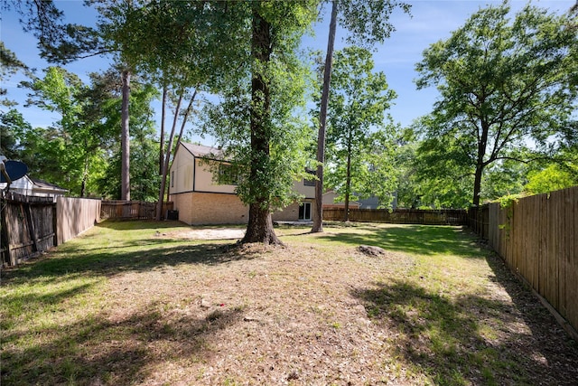 view of yard with a fenced backyard
