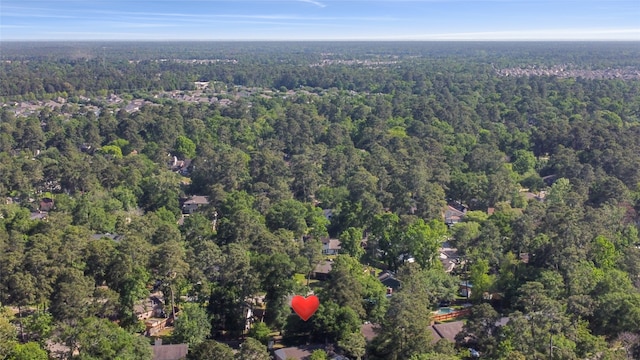 bird's eye view featuring a forest view